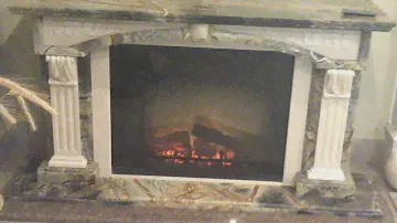 Мраморный портал и топка Dimplex Multifire 32